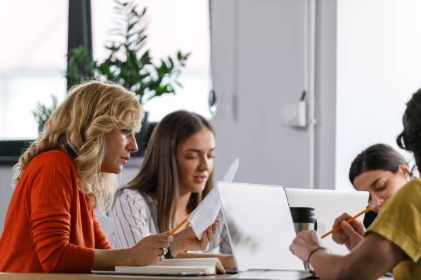 istock Group of diligent business people working on a project together 1362896168