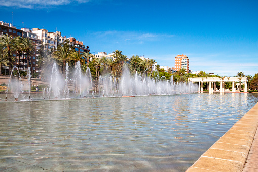 The public square with Fuente (fountains) of Del Palacio De La Música at Turia Gardens in Valencia, Spain
