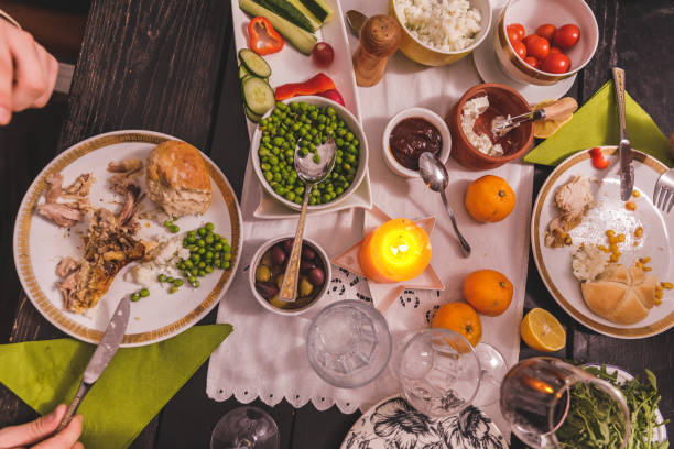 istock Delicious feast set out on a dining table, decorated with tangerines and a candle 1362897773
