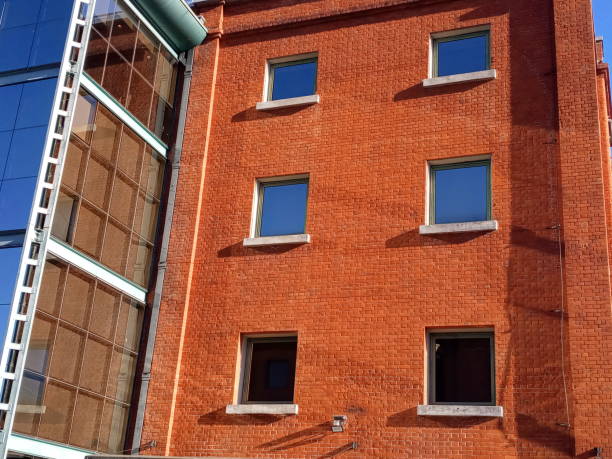 istock Red brick building with blue glass windows 1362899506