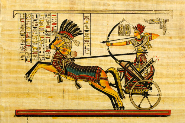Pharaoh in the chariot - Egyptian souvenir papyrus Pharaoh in the chariot - Egyptian souvenir papyrus with with elements of egyptian history and religion rameses ii stock pictures, royalty-free photos & images