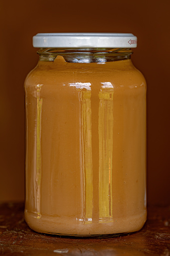 Paste dulce de leche in a glass with selective focus