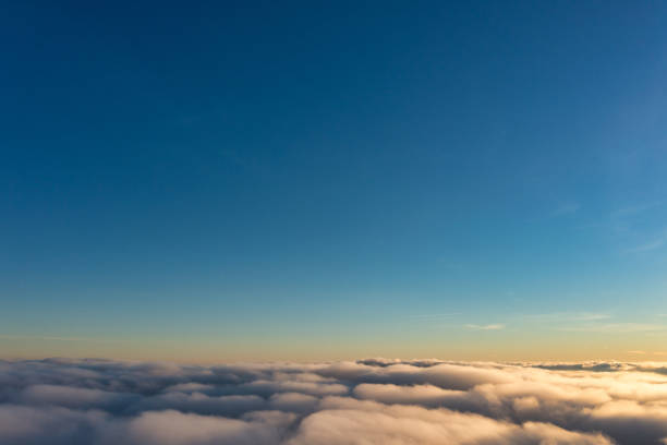 istock Thick fog covering mountain hills at bright sunset 1362901711