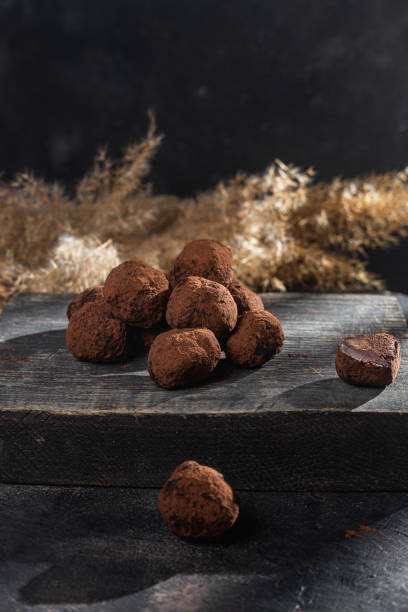 istock Dark chocolate truffle on dark background 1362903389
