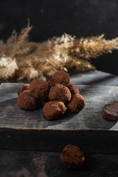 istock Dark chocolate truffle on dark background 1362903390