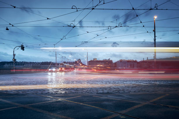 istock Light trail of tram in road intersection 1362904171
