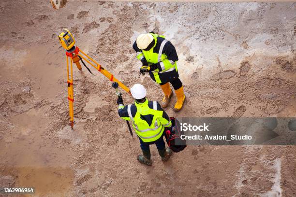 Surveyor At The Construction Site Stock Photo - Download Image Now - Surveyor, Geodesy, Geodesic Dome
