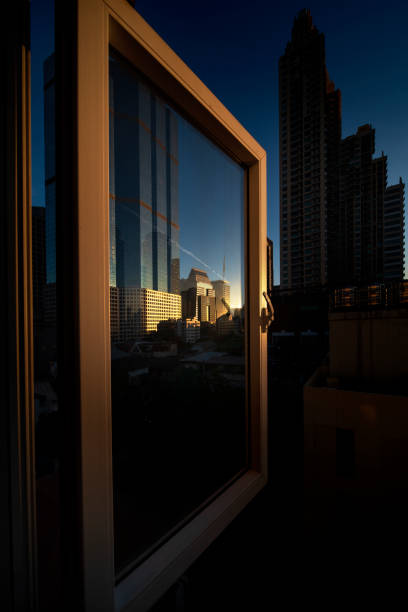 istock The windows opened to see reflections of buildings. 1362909285