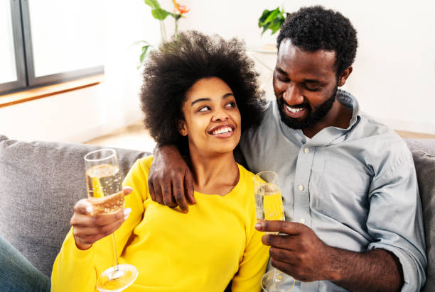 istock Afro american couple celebrating at home 1362910069