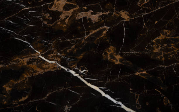 istock Black floor tile with brown spots making a natural background 1362911425