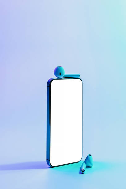istock Device mockups. Mobile smartphone technology blank screen. Mock up smart phone device, audio headphones equipment on neon gradient banner background. Mockup for application or website design project. 1362911679