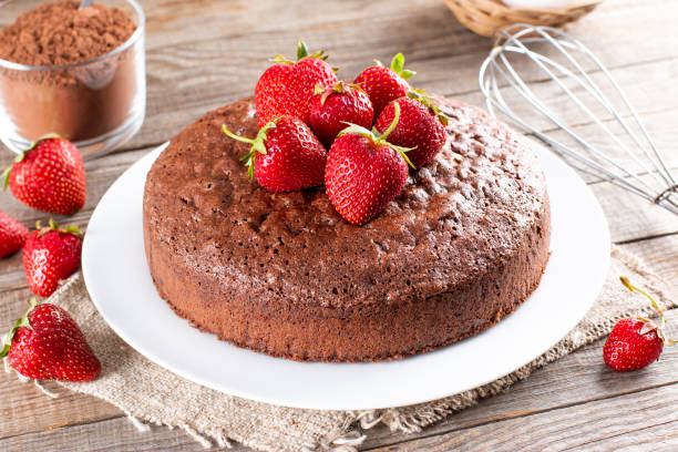 istock Chocolate sponge cake with strawberry on a table 1362914259