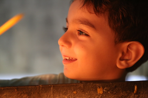 portrait of child reflected by candlelight
