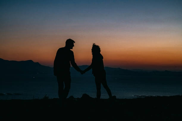 Silhouette of Young Couple at Sunset