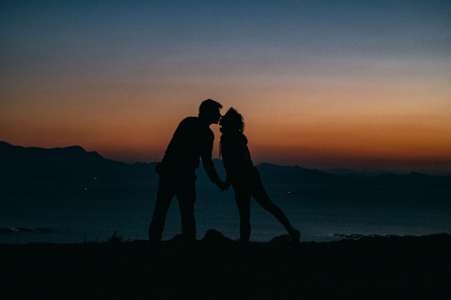 Silhouette of Young Couple at Sunset