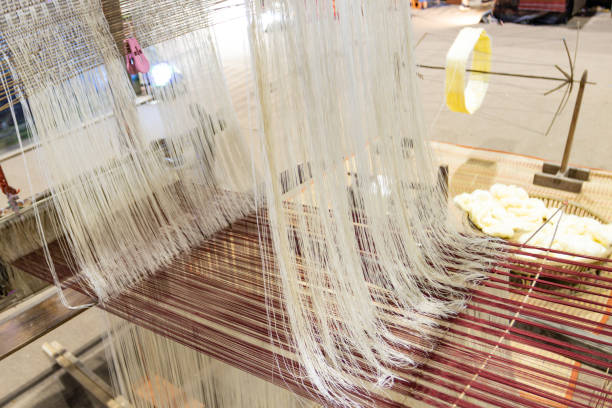 Household Loom weaving - Detail of weaving loom for homemade silk or textile production of Thailand stock photo