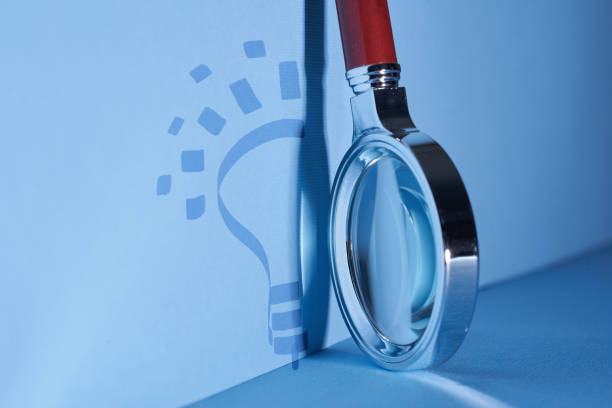 istock silver magnifying glass on the blue background 1362920168