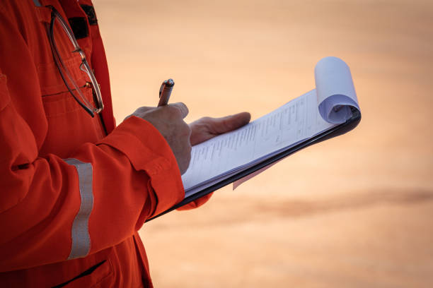 istock Writing note on paper - Audit and inspection in oil field operation. 1362920202