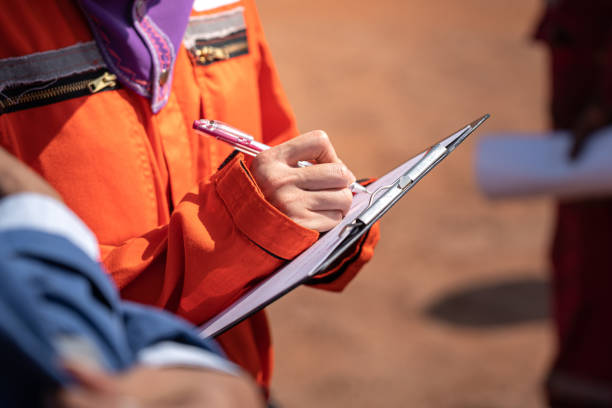 istock Writing note on paper - Audit and inspection in oil field operation. 1362920203