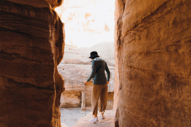 istock Female traveler exploring Jordan hiking inside the canyon 1362923021