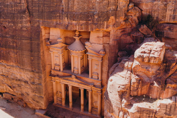 The ancient world of Petra in Jordan Scenic aerial view of the old architecture with stoned building in the cliff at Petra town, Jordan, Middle East akaba stock pictures, royalty-free photos & images