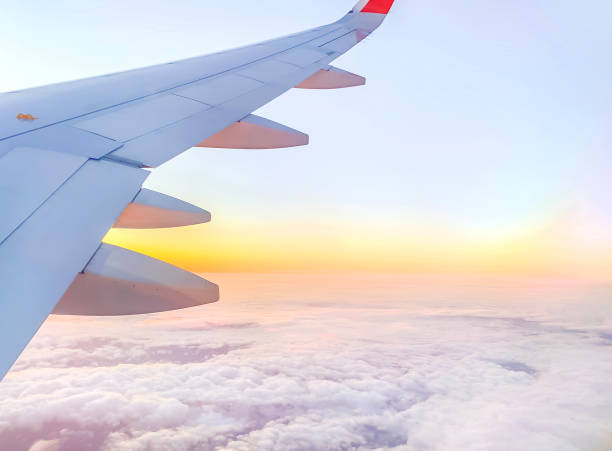 istock Airplane wing in the sky at beautiful sunset 1362924171