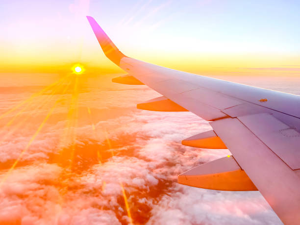 istock Airplane wing in the sky at beautiful sunset 1362924176
