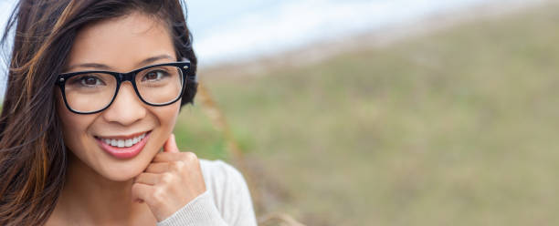 Chinese Asian Young Woman or Girl Wearing Glasses Panorama Web Banner stock photo