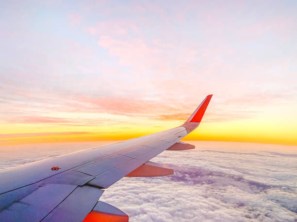 istock Airplane wing in the sky at beautiful sunset 1362924642