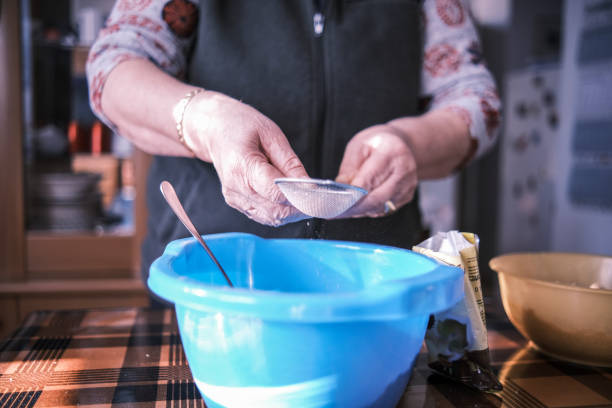 istock Using a small sieve for cocoa in my recipe 1362925259