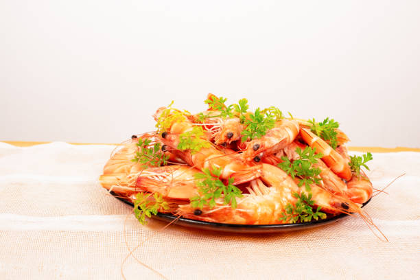 Appetizing Shrimp beautifully decorated with parsley in a plate on the table,With rustic cloth