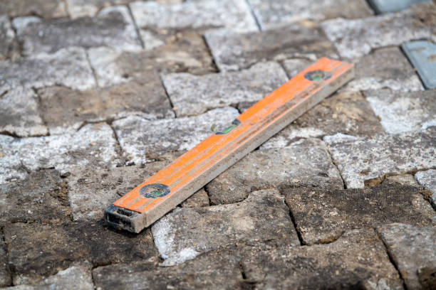 istock Orange spirit level on newly constructed street work 1362925769