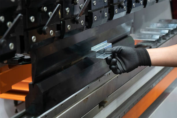 istock The hand of technician operator working with hydraulic press brake bending machine. 1362927774