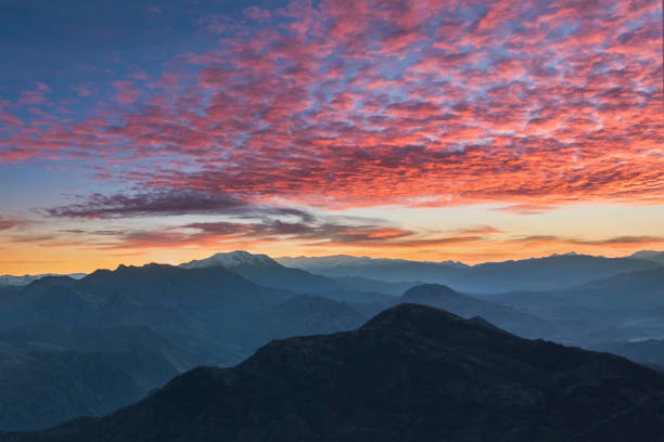 istock Beautiful mountains silhouettes with dramatic sky at sunset 1362929043