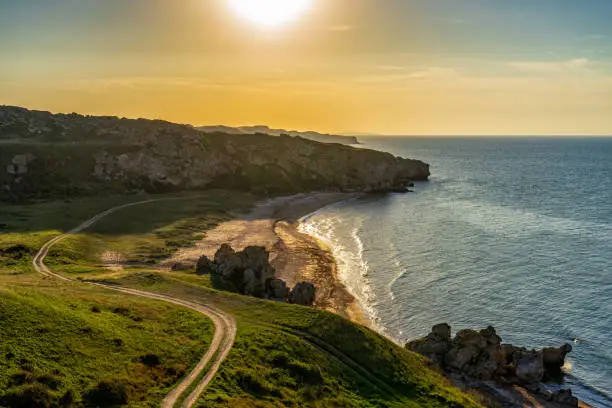 Amazing landscape with sea bay, sand beach and coastal hills and rocks on summer evening at sunset. Trip to seaside. General's beaches or Generalskie Plyazhi or coast of thousand bays, Crimea.