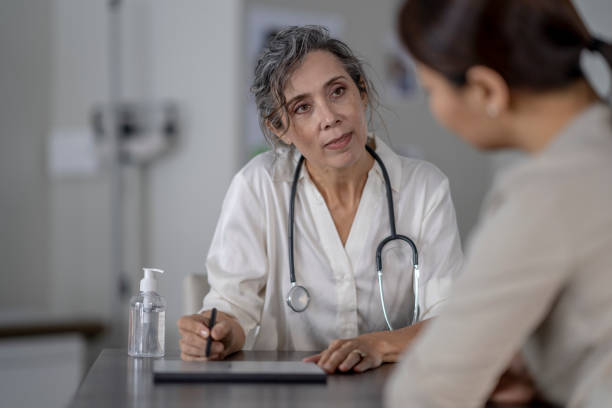 istock Doctor listens to her patient 1362938736