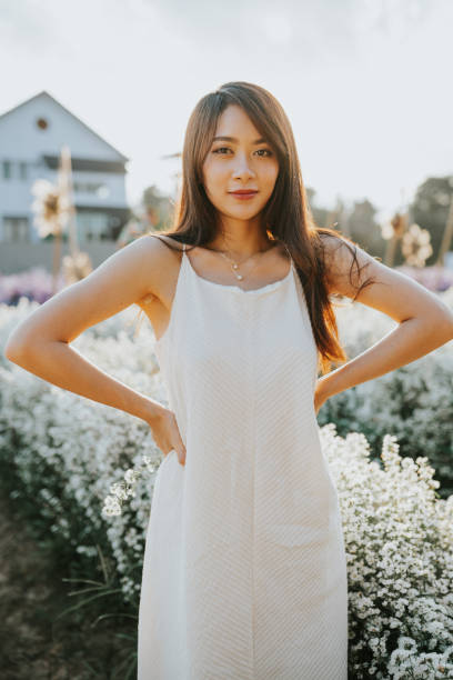 istock Thai woman in flower field 1362938766