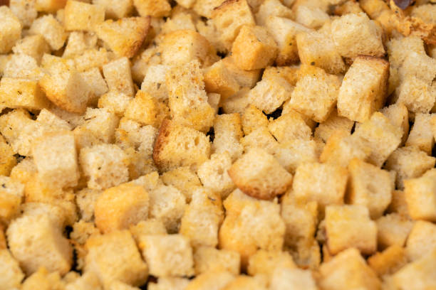 istock Oven - baked white bread crackers with spices and garlic , selective focus 1362939653