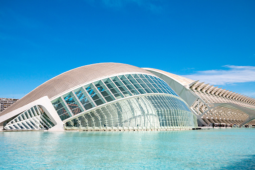 L'Hemisfèric, designed by Santiago Calatrava, represents a human eye (the eye of wisdom) and was inaugurated in 1998. It acts as an IMAX and movie theater.