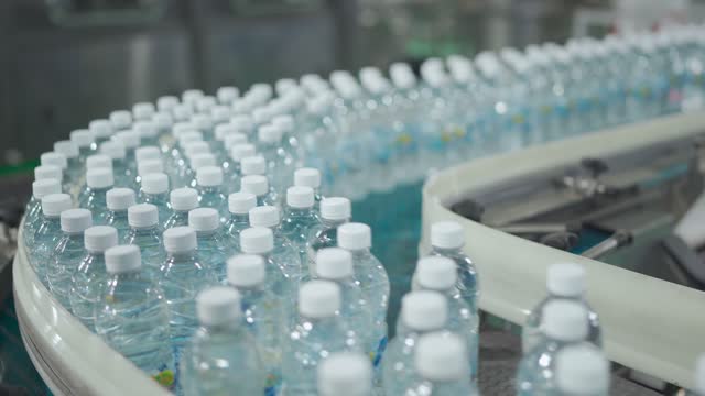 mineral water Factory production line at finishing line in a row moving queuing for packing