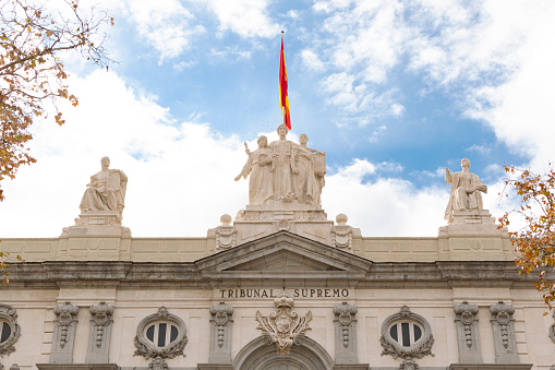 Madrid, Spain - December 19, 2021:  Detail of the main facade of the Supreme Court building in Madrid, Spain.