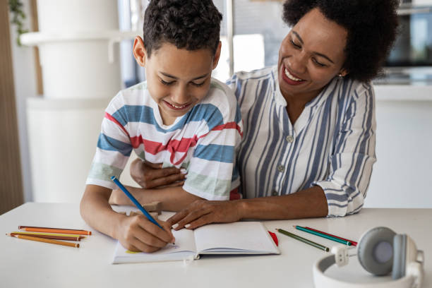 istock Mother helping her son with homework 1362942800