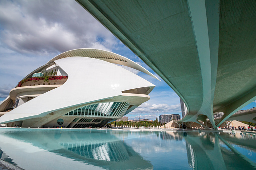 Designed by Santiago Calatrava, it was opened on 8 October 2005 and staged Beethoven's Fidelio in 2006. People are visible in the distance.