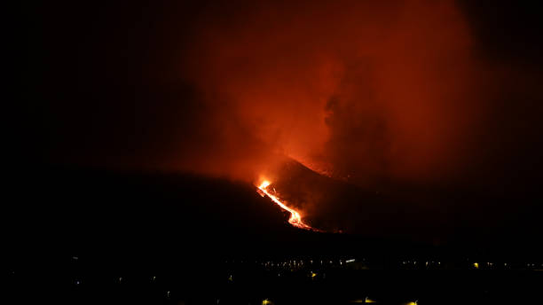 istock LAVA DESCENDING BY VOLCANO SLIDE AT NIGHT 1362943791