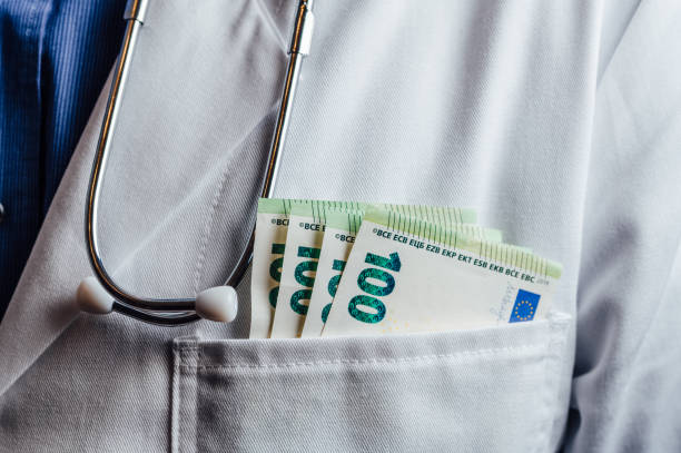 istock Patients bribing doctors for a faster and better service 1362945192