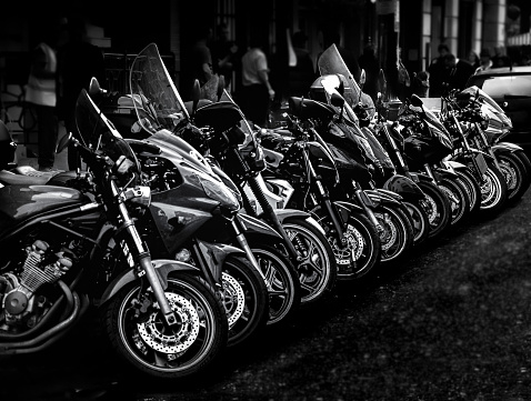 Motorbikes in a row in black and white