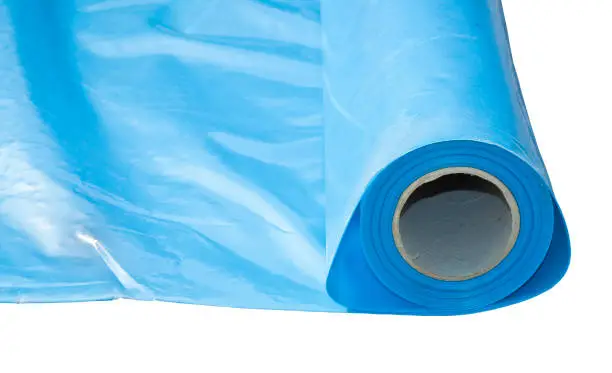 Photo of Polyethylene protection vapour barrier to restrict the passage of vapour from the hot part of the structure to the cold part of roof and wall - image isolated for easy selection