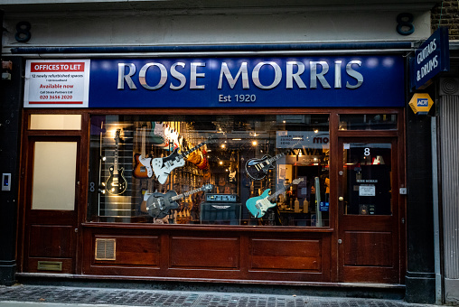 LONDON, UK, October 6 2021. Rose Morris music shop in Denmark Street, central London, UK. Denmark St, otherwise known as Tin Pan Alley, was the hub of the British music scene for decades. Today, much of it has gone, swallowed up by redevelopment plans for the nearby Tottenham Court Road station.