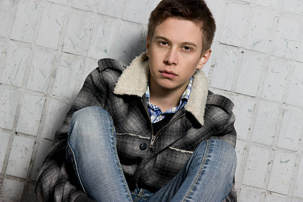 istock young sad cute guy looks at you 136295090