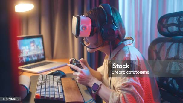 Virtual Reality Gaming And Metaverse Concept Women Have Fun Playing Vr Games At Home Stock Photo - Download Image Now